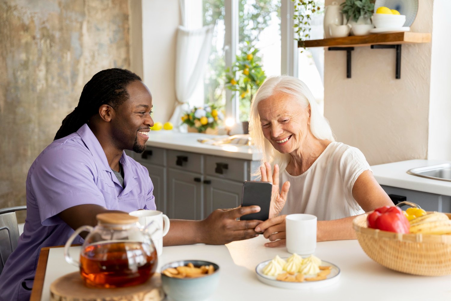 Caregiver sharing a warm meal with an elderly client at home