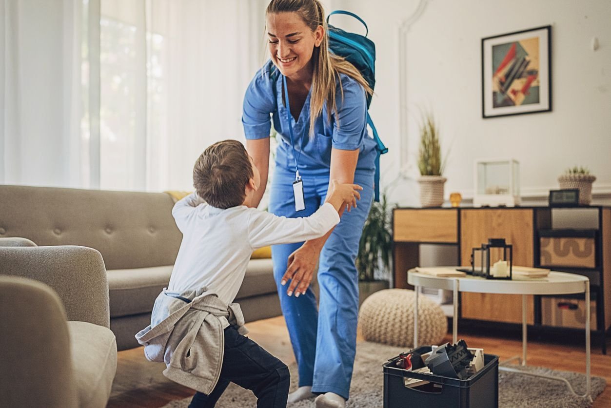 Nurse caring for child at home