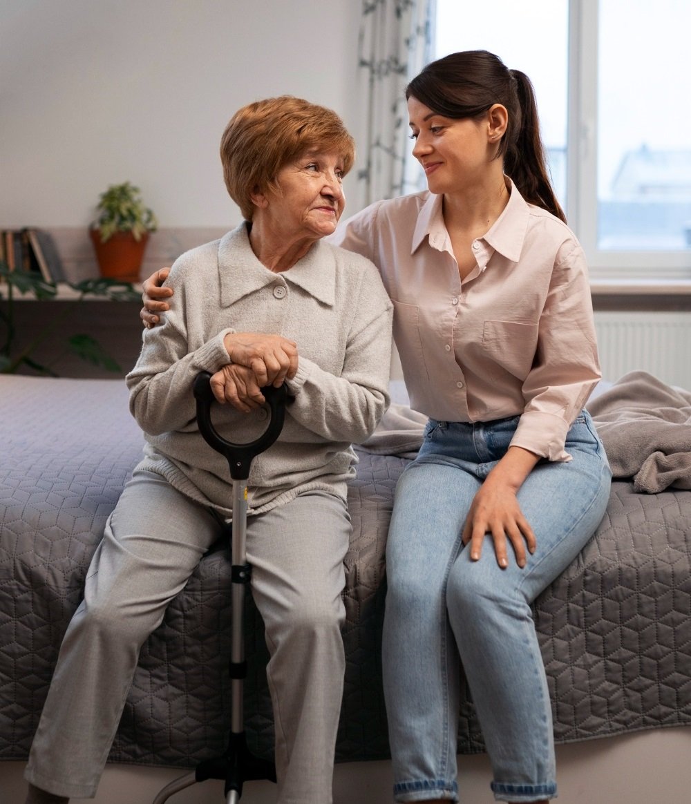 A caregiver helping an elderly